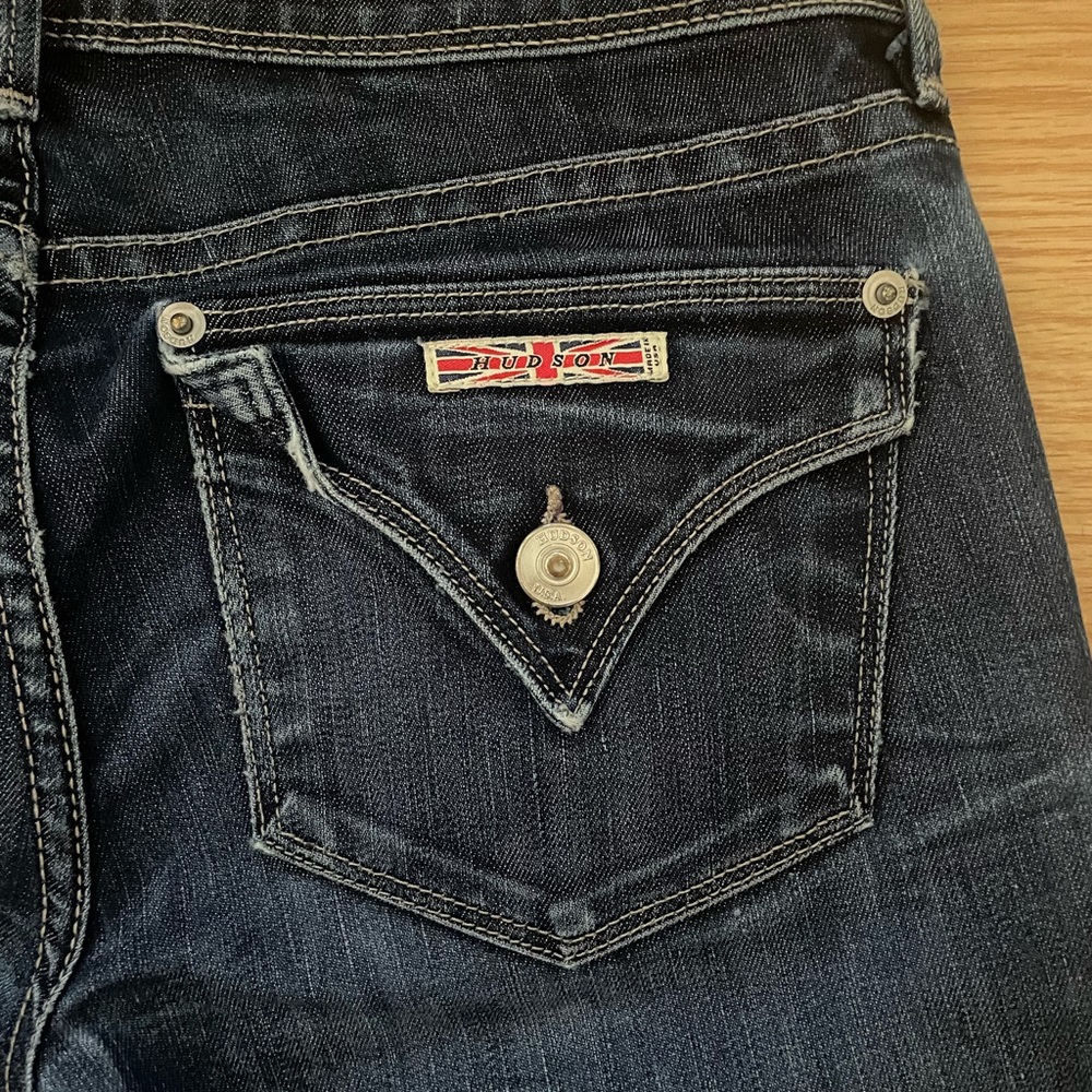 Slight wear on the ankle, back pockets are accessible, long in length